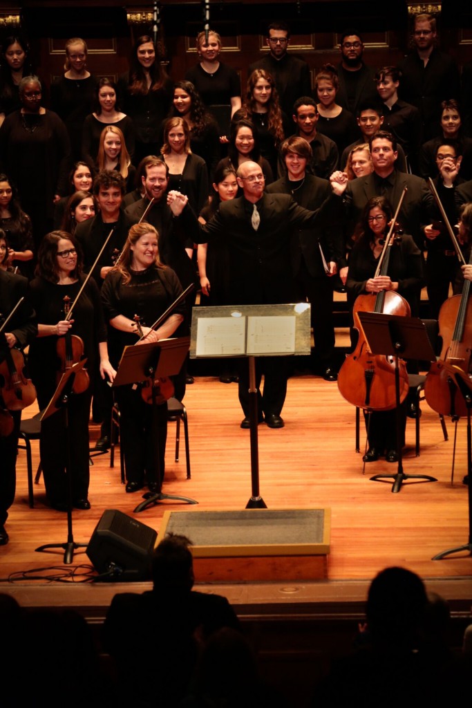 Gil Rose acknowledges applause following the Boston Modern Orchestra Project's performance of Tigran Mansurian's Requiem Sunday at Jordan Hall. Photo: Kathy WIttman 