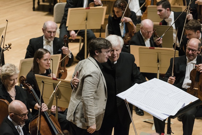 Jean-Frederic Neuberger and Christoph von Dohnanyi acknowledge applause following the world premiere of Neuberger's "Aube by the BSO Thursday night at Symphony Hall. Photo: Liza Voll