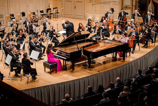 Christina and Michelle Naughton performed Mozart's Concerto for Two Pianos Thursday night.